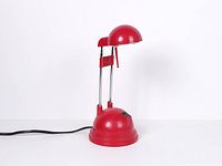 Full view of red IKEA Espressivo desk lamp showing overall design
