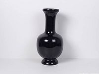 Full view of black ceramic vase front