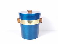 Full view of ice bucket showing color, brass band and handles