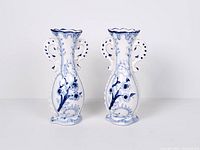 Full view of the two matching blue and white porcelain vases