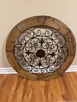 Front view of wood and metal wall medallion