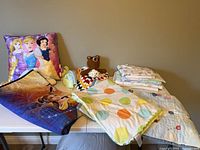 Overview of all blankets, pillow, crochet lovey, receiving blankets