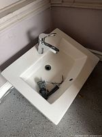 Top view of sink showing basin, faucet, drain