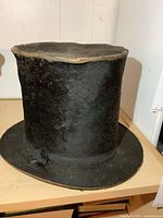 Overall view of black beaver top hat front and side