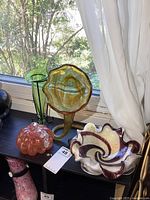 All four art glass pieces on shelf