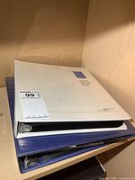 Stacked white and blue binders