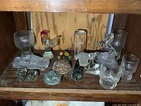 Overall view of glass items on shelf