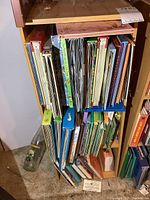 Three shelves filled with large format children’s pop-up books