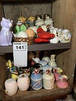 Two shelves filled with assorted salt and pepper shaker pairs