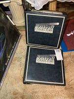 Two closed blue binders titled Baseball Collectors Trading Cards