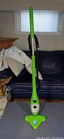 Front view of green H2O Mop X5 steam cleaner standing upright