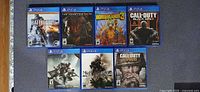 Front view of all seven PS4 game cases