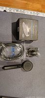 Boxed set with hose, bracket, wand, and shower head