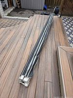 Awning rolled up on deck, showing full length and fabric colour