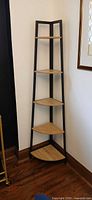 Full view of 5-tier corner shelf against wall showing overall design