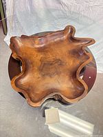 Top view of entire burl wood bowl showing freeform shape and grain.