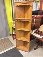 Front view of entire corner bookcase