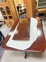 Table top with leaves placed on padding