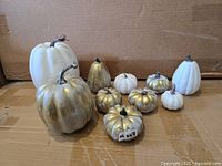 Front view of all 10 artificial pumpkins