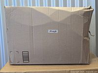 Amazon shipping box containing GoSports Chip N' Stick Golf Game set