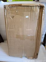 Closed original cardboard box with handling damage