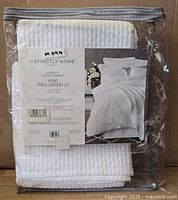 Front of sealed package showing brand, style and size