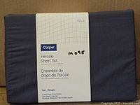 Folded new Casper Percale Sheet Set with label showing size and components