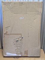 sealed cardboard shipping box containing the canvas print