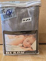 Front of packaged blackout curtain panels