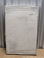 Front of plain cardboard box labelled M105