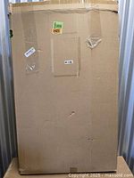 sealed cardboard box containing the floating golf green set