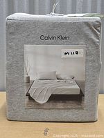 Front of sealed Calvin Klein Harrison king fitted sheet package