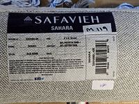 Close-up of manufacturer label showing design SAH490J-6R, composition, size 6' x 6' round