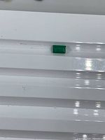 Emerald on white background showing size and color