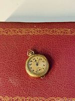 Front of Hamilton ladies pocket watch showing dial and engraving