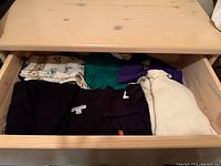 Drawer showing all garments and scarves