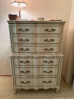 Front view of the vintage French Provincial chest showing all drawers, hardware, finish, and size context