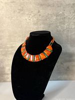 Front view of necklace on bust showing bead layout