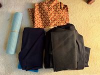 All fabrics and mat laid out on floor