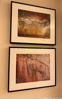 Both framed prints hanging on wall, showing overall set