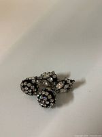 Front view showing both earrings and rhinestone detailing