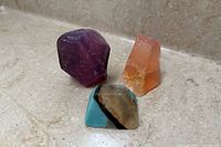 Three decorative soaps arranged on countertop