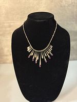 Front view showing full bib design and stone drops