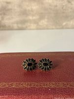 Front view showing floral design and onyx stones