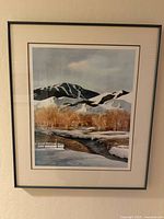 Full view of framed print on wall