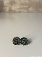 front view showing turquoise cluster design of both earrings