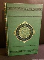 Front cover showing green cloth binding with gilt and black design