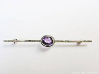 Full view of bar brooch showing amethyst and length