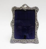 Front view of sterling silver photo frame with dark patina and bevelled glass