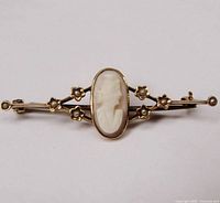 Front view of Edwardian 14k gold bar pin with cameo and seed pearls